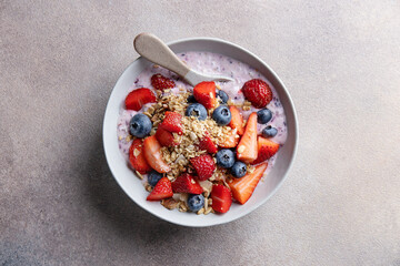 Muesli with fruits served in bowl