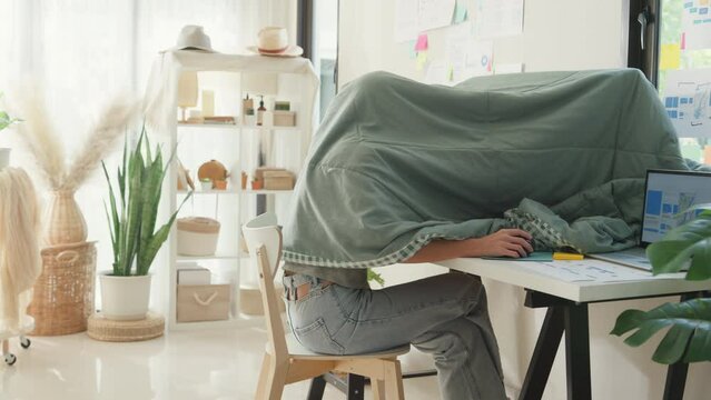 Night owl Young Asia girl development programmer use blanket cover need dim light concentrate create coding program database on computer at house office. Workaholic suffering mental health concept.