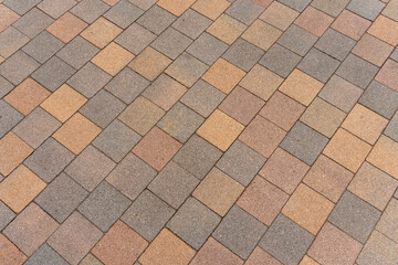 Textured paving tiles of square shape