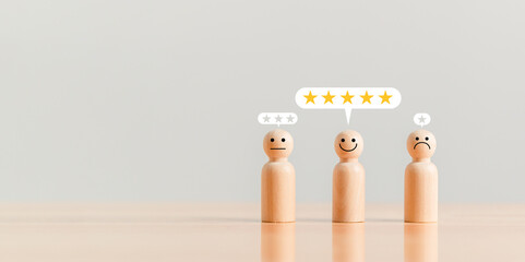 Customer service rating in five stars as an excellent employee in the company on wooden table...