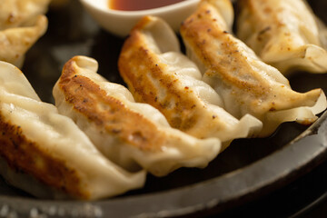 Fried dumplings on iron plate