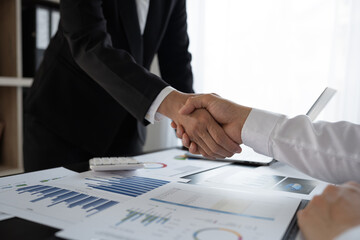 Business people meeting at partner office, professional executives working on financial strategy in workplace handshake for a successful deal.