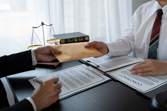 Businessman bribes officials or lawyers to commit corruption in lawsuits Unlawful acts of law enforcement by paying bribes to officials. Fraud concept, corruption