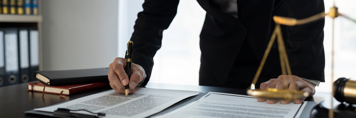 Confident lawyer or businessman examining details in real estate legal contract document Legal service concept, advice, justice.