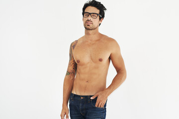 Portrait, shirtless and glasses with a sexy man model in studio on a white background for masculine...