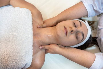 professional massage therapist woman makes a relaxing massage for a good client.