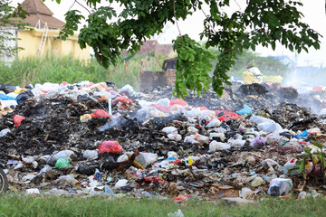 landfills in cities.  Burning garbage in an open place for the public.  Environmental pollution due to burning waste