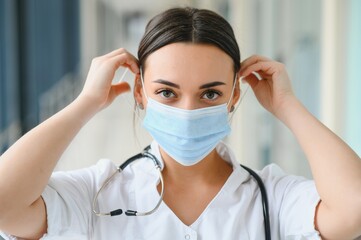 portrait of female doctor wearing protective mask.