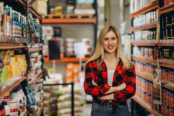 pretty hardware store employee looking at the camera.