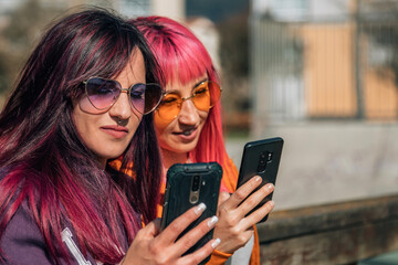 urban young women with mobile phone in the street