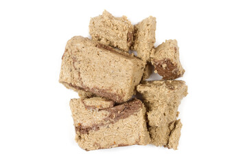 Sweet halva on a white background. Confectionery. A bunch of halva.