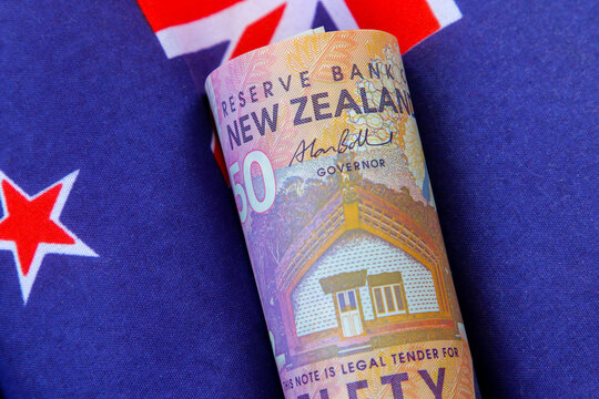 New Zealand dollar notes with the NZ flag.