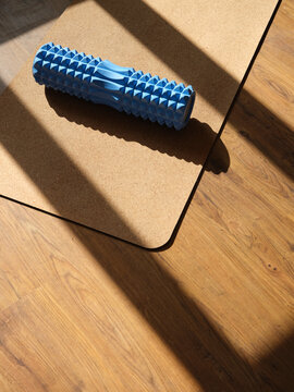 Image of corkwood yoga mat on the floor of a bright sunny studio with copyspace