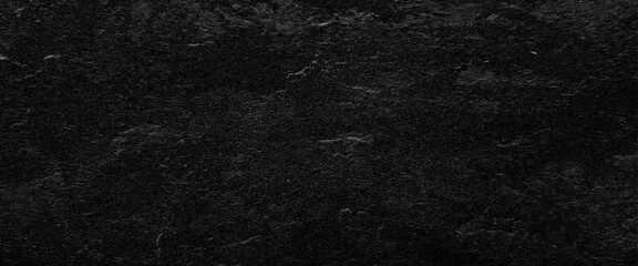 Natural black slate stone background pattern with high resolution. Top view, copy space.