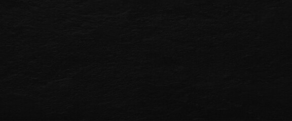 Natural black slate stone background pattern with high resolution. Top view, copy space.