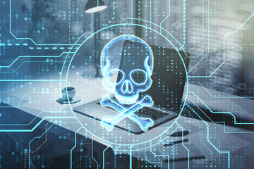 Close up of laptop computer with glowing digital circuit binary code skull on blurry workplace background. Hacking, piracy, malware and data theft concept. Double exposure.