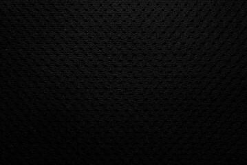 Abstract black fabric texture background or dark grey cloth texture background with vignette effect