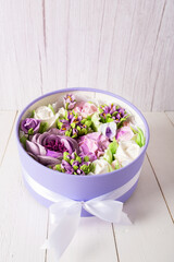 Gift box with a bouquet of flowers made from airy sweet marshmallows