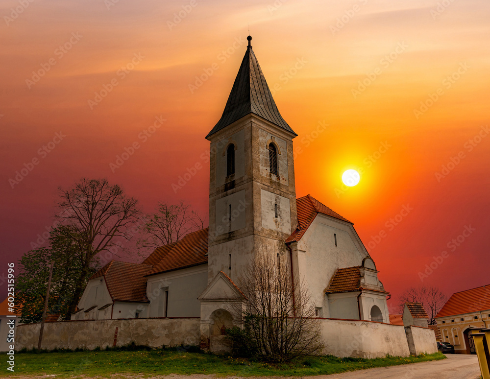 Wall mural rural church at sunset.