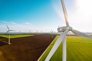 Drone view of wind turbine on agricultural field