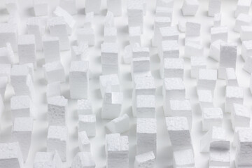 Model of a chaotic city made up of rectangular pieces of white polystyrene.