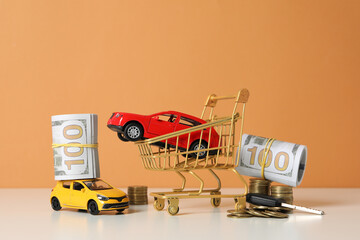 Concept of car purchase and insurance with toy car