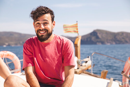 Smiling Man Enjoying Vacation On Yacht At Sunny Day