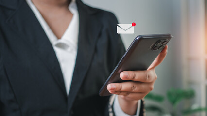 Business woman hand using smartphone  application communication . New email notification concept for business email communication and digital marketing. 