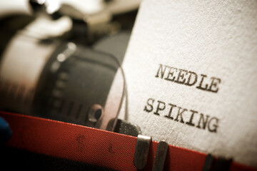 Needle spiking text