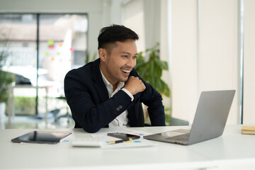 Businessman talking to customers online together at the office.