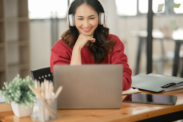 Asian businesswoman sitting and working about documents at the office