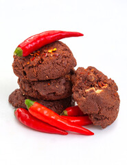 chili and chocolate biscuits or cookies isolated on white  with fresh chili peppers