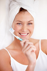 Portrait, happy woman and brushing teeth with shower towel for healthy dental wellness. Face of female person cleaning mouth with toothbrush, toothpaste and fresh breath of smile, cosmetics and care
