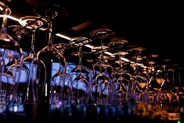 Clean wine glasses in the night bar