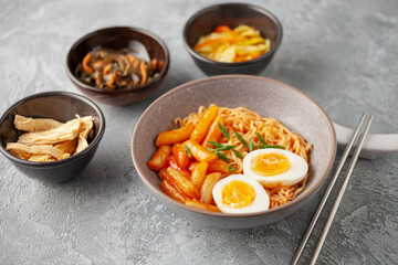 Rabokki (Ramen or Korean instant noodle and Tteokbokki) in spicy korean sauce - Korean food style