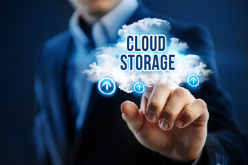 Cloud storage concept. Businessman uses cloud storage technology.