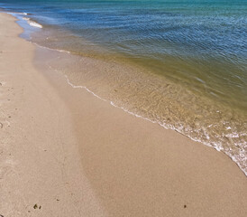 Fototapeta na wymiar Waves on the beach. Sand on the beach. 