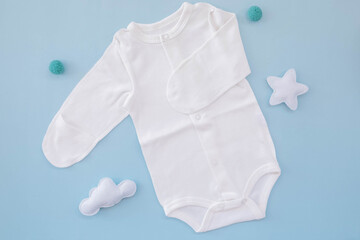 Bodysuit for a newborn on a blue background. Waiting for the boy. Clothes for newborns