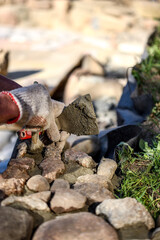 Hands of an old master mason
