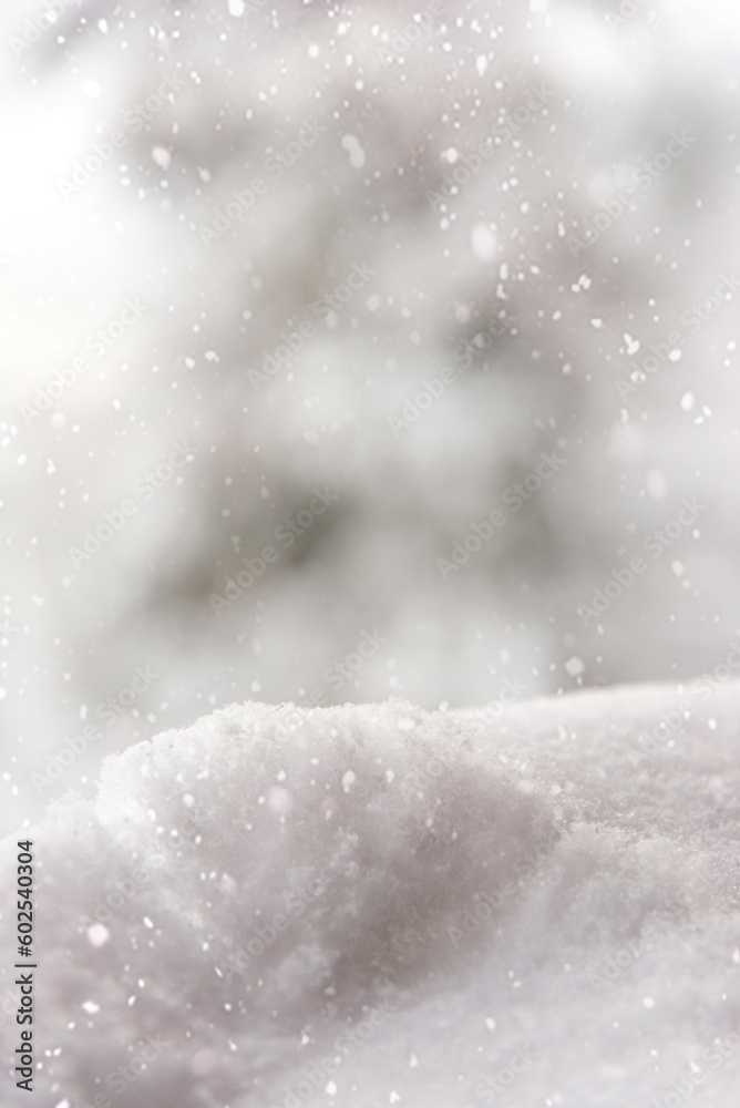 Canvas Prints Winter bright snowy background. New Year's landscape with snowdrifts and snowflakes. Selective focus. Vertical photo.