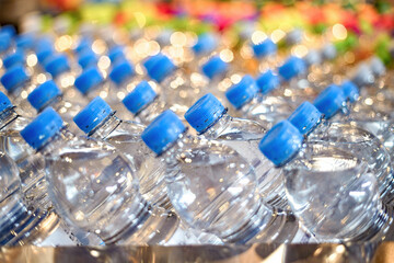 plastic transparent water bottles for drinking on a warehouse showcase in a stor