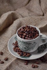 Roasted coffee beans in a Kopitiam cup