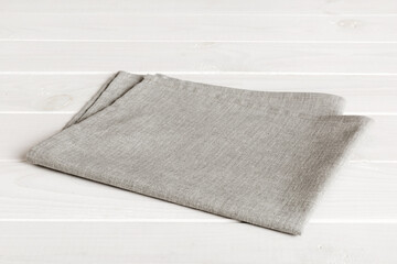 top view with gray kitchen napkin isolated on table background. Folded cloth for mockup with copy space, Flat lay. Minimal style