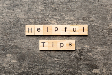 helpful tips word written on wood block. helpful tips text on table, concept