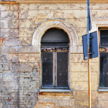 ancient windows on the vintage wall. antique architectural element in dust