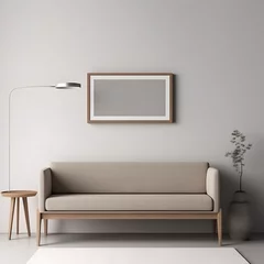 Fototapeten Horizontaal wooden mockup frame hanging over a sofa. Minimalistic style with a green flower and a lamp.  © Daniel