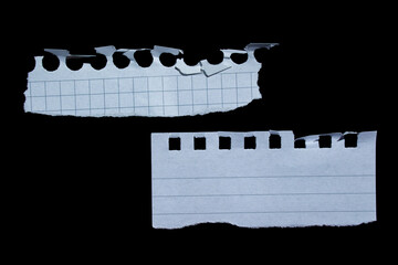 Set of ripped piece of paper isolated on black background. Torn papers.