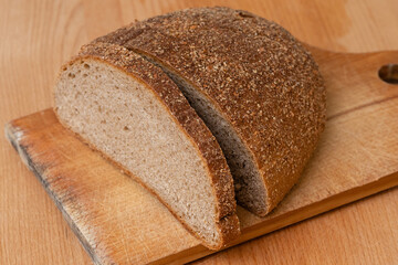 Sliced rye bread on a wooden board