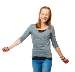 Fototapeta premium Studio, portrait and a happy teenage girl for fashion or carefree or pose and standing against a white background. Style, face and young kid smile or child model confident in jeans and shirt