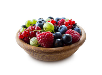 Mix berries in bowl on white background. Berries isolated on a white background. Raspberries, currants, blueberries, blackberries, gooseberries.